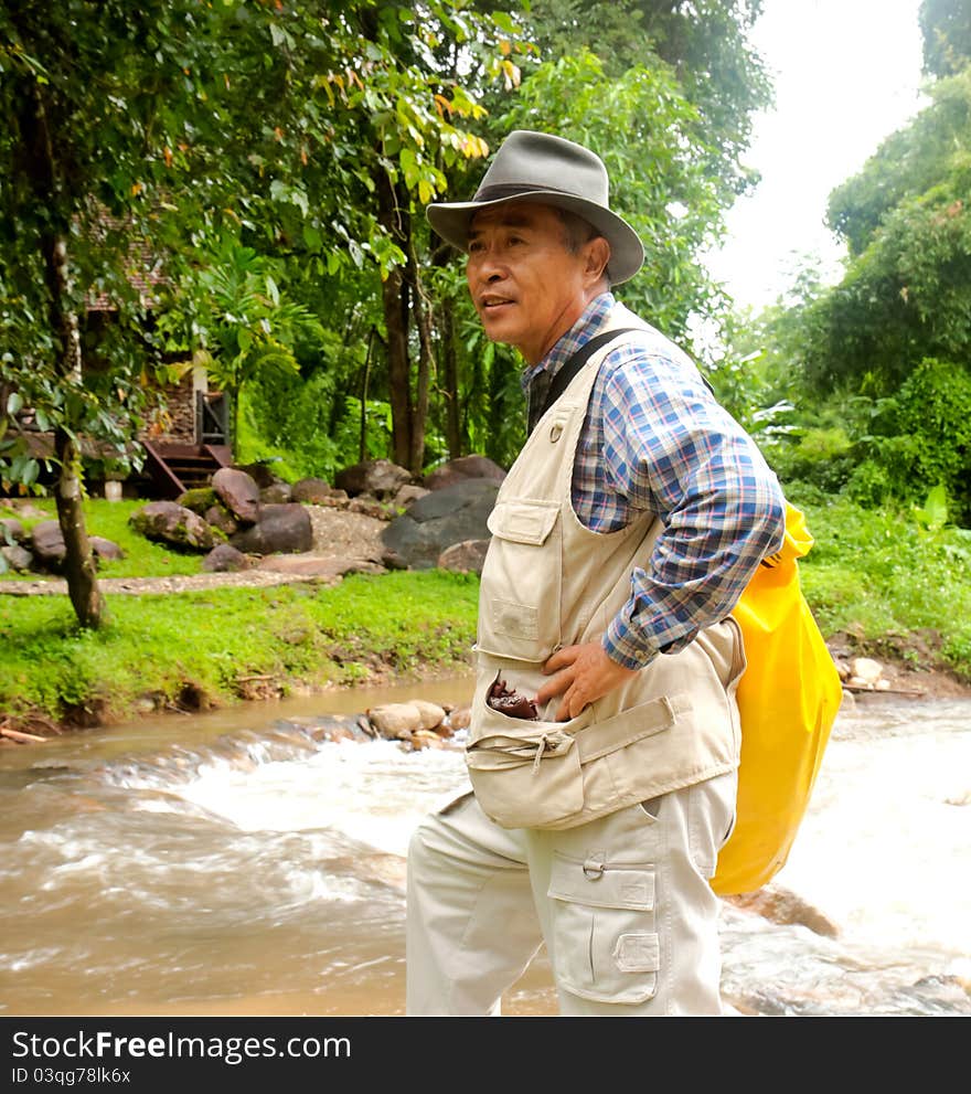 Happy old man in forest