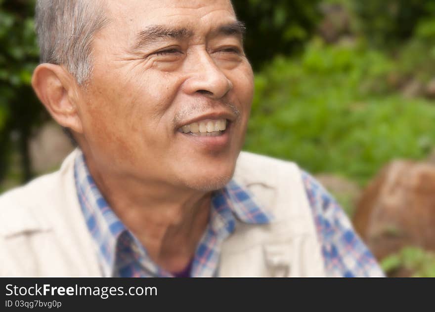 Closeup Profile on an old man Smiling. Closeup Profile on an old man Smiling