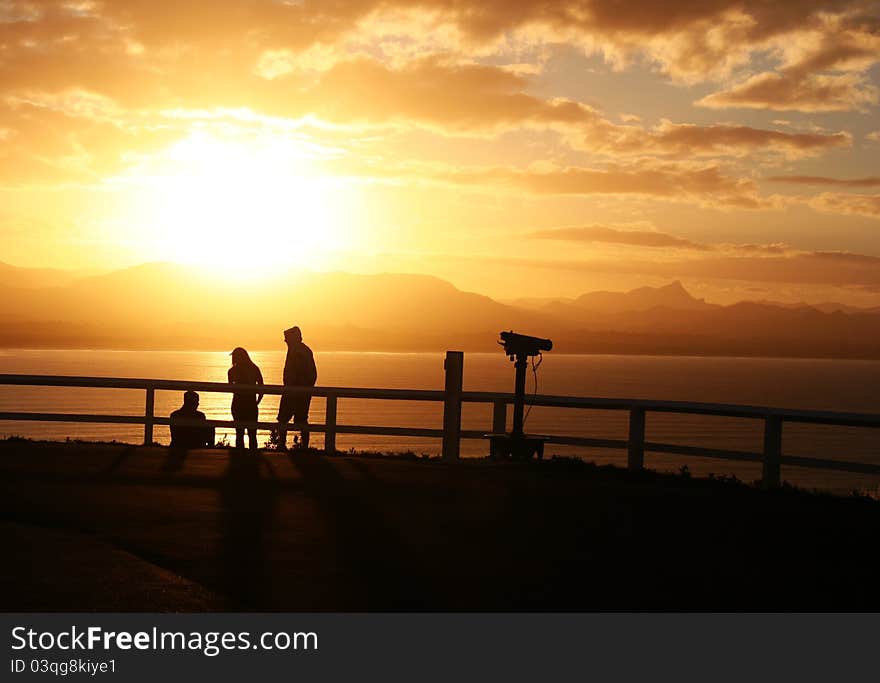 Beautiful sunset in Byron Bay, NSW with people chillin' in sunlight