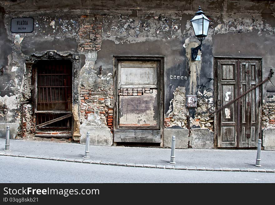 Three different style doors of an old, unmaintained building in Zagreb, Croatia. Three different style doors of an old, unmaintained building in Zagreb, Croatia.