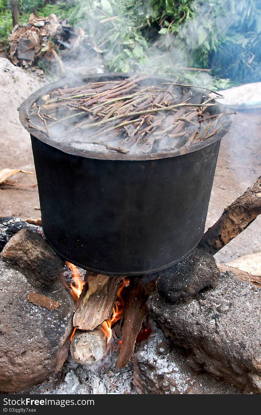 Inside a tree nursery/conservation center in Moshi, Tanzania, tree branches are being cooked so that the skins can be easily peeled off after. The tree skins will then be used to make paper. Inside a tree nursery/conservation center in Moshi, Tanzania, tree branches are being cooked so that the skins can be easily peeled off after. The tree skins will then be used to make paper.