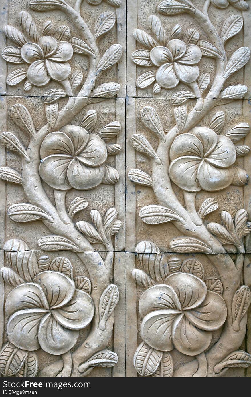 Flower shape stone carving on wall in bali style