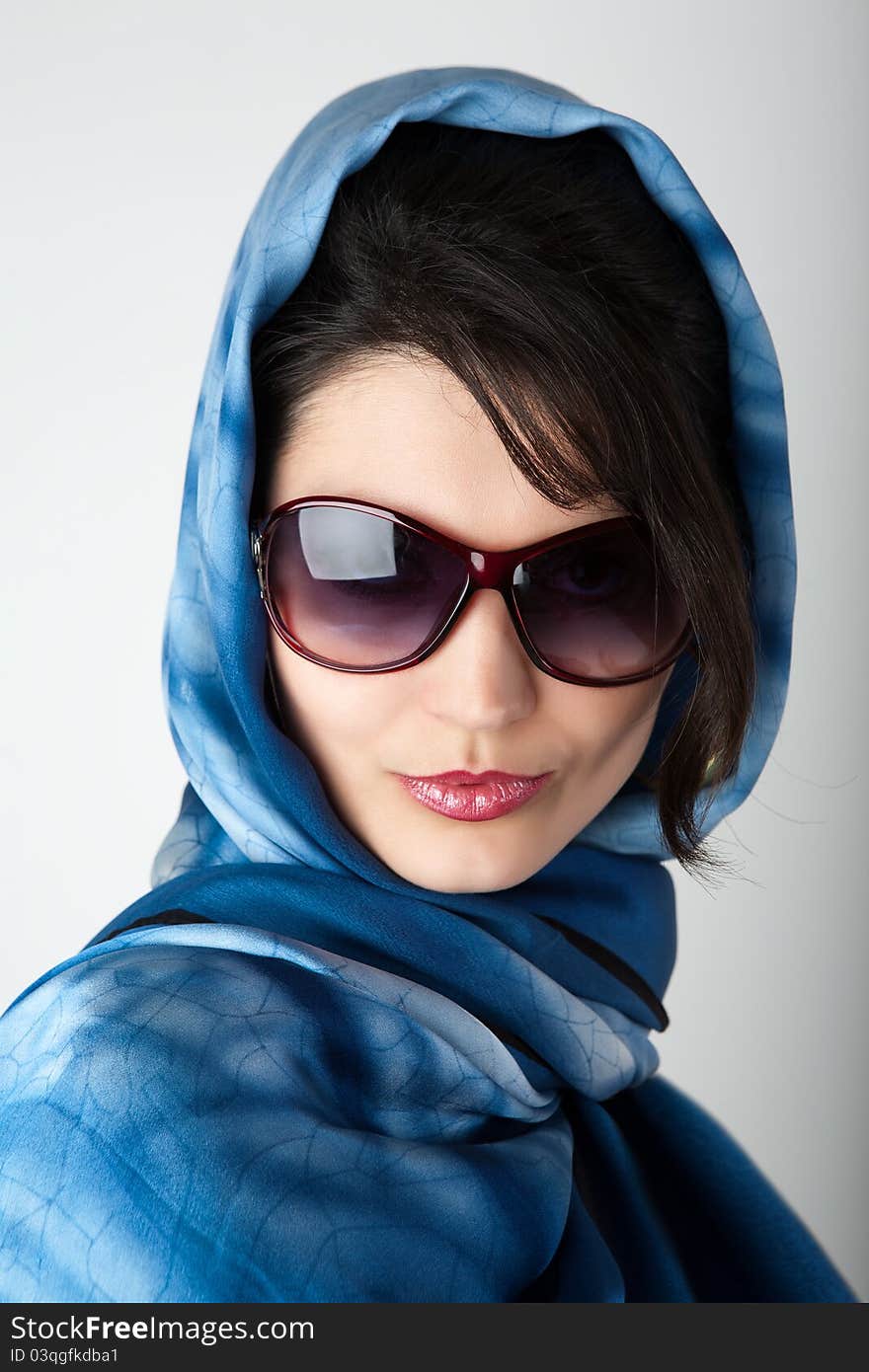 Portrait of young woman in big sunglasses. Portrait of young woman in big sunglasses.