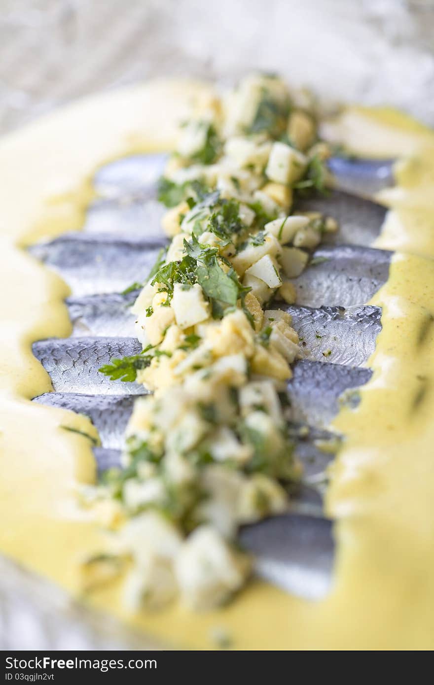 Sliced Herring in curry yellow sauce. Sliced Herring in curry yellow sauce