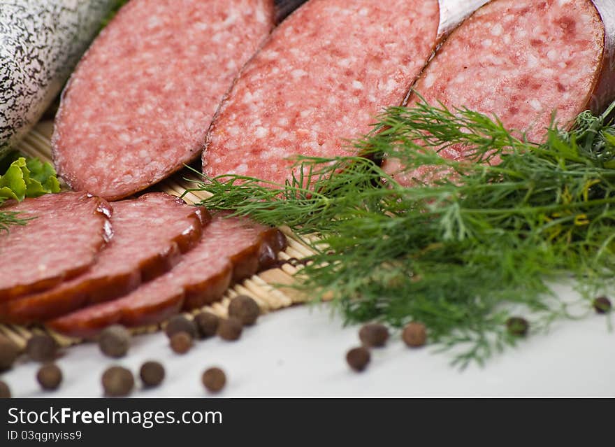 Sausages and ham with lettuce and tomatoes