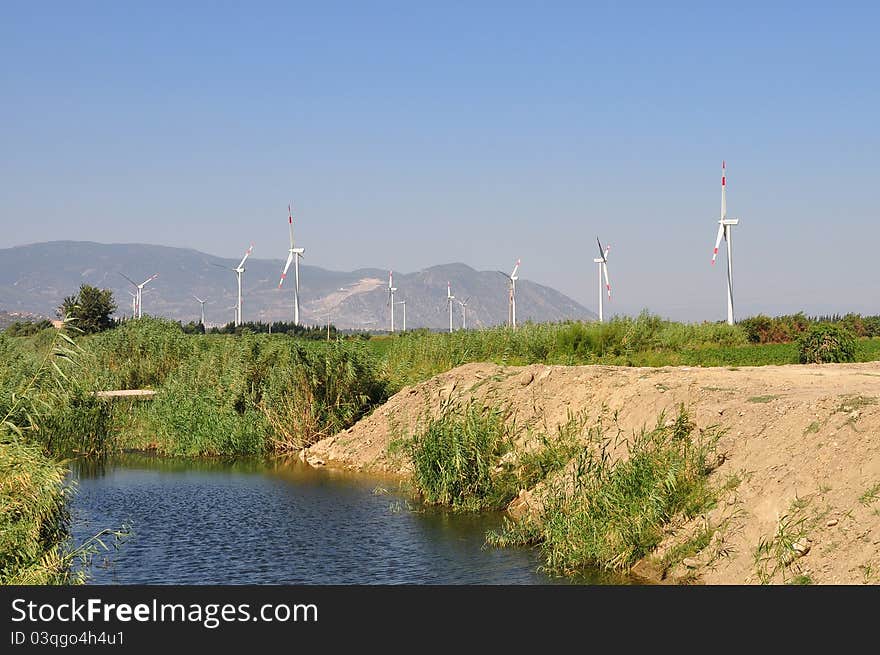 Wind turbines near creek