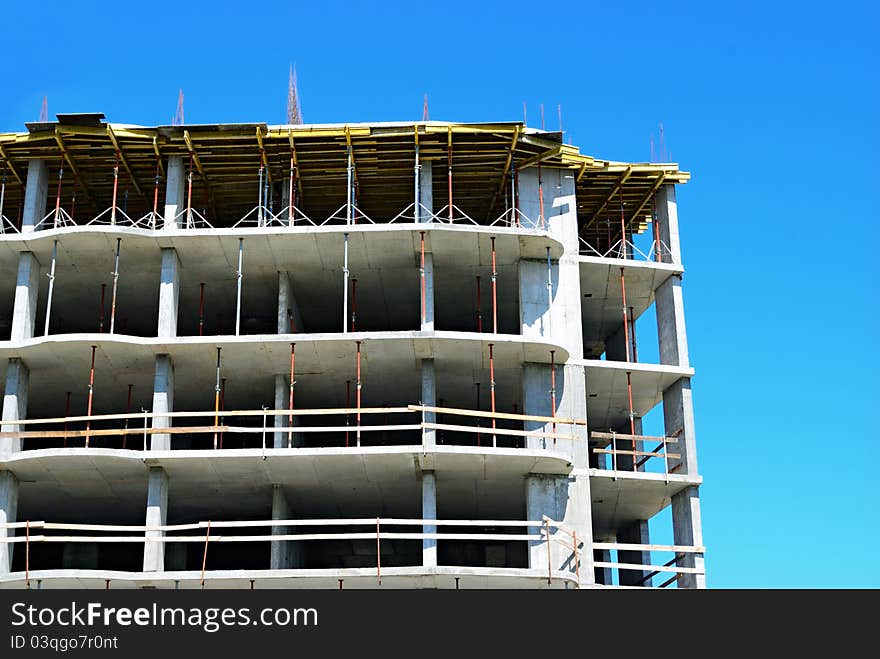 Construction site and angle of building on blue sky background. Construction site and angle of building on blue sky background