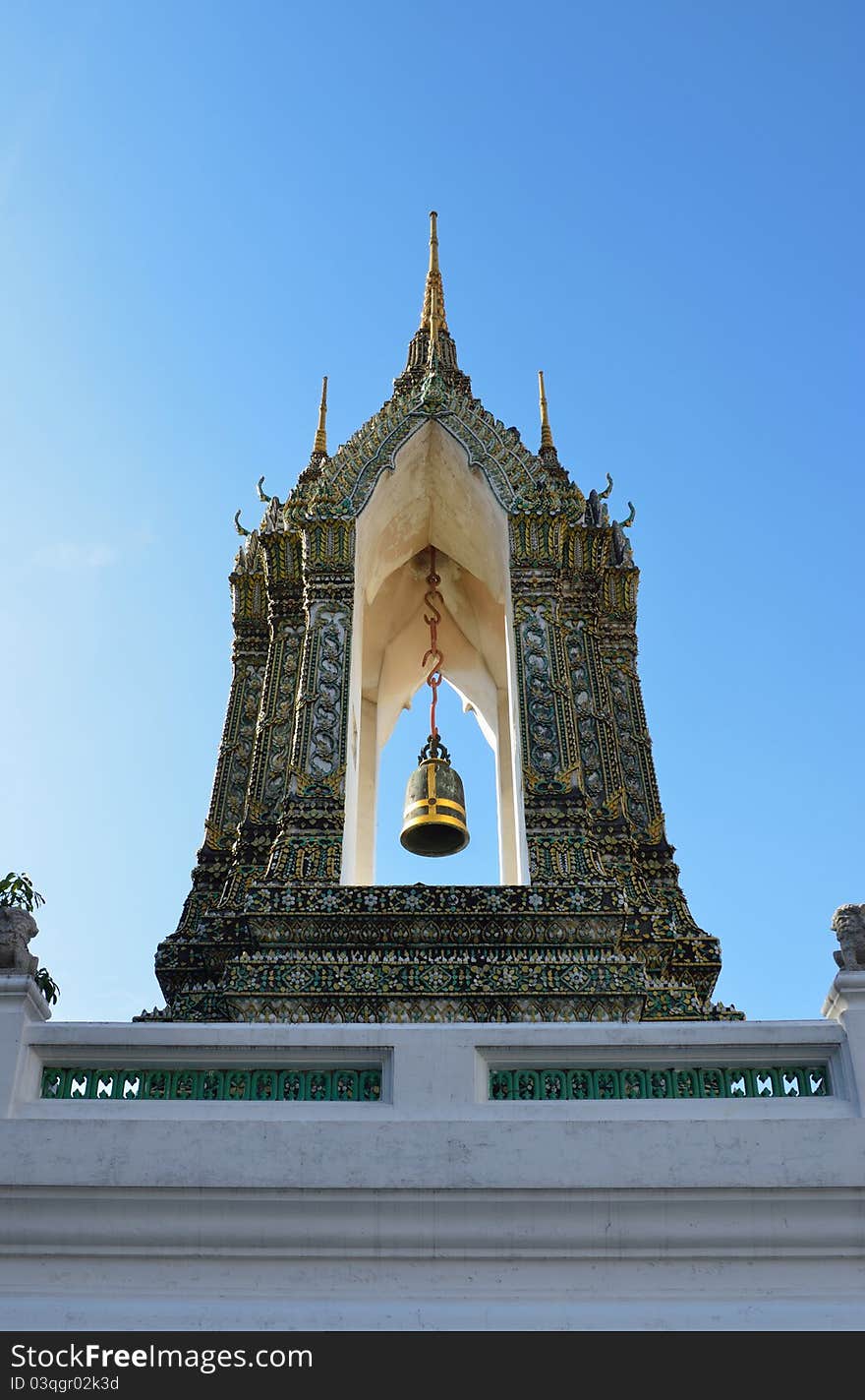 The colorful, richly decorated pottery and bell tower, the Buddhist temple of Wat Pho in Bangkok, Thailand. The colorful, richly decorated pottery and bell tower, the Buddhist temple of Wat Pho in Bangkok, Thailand