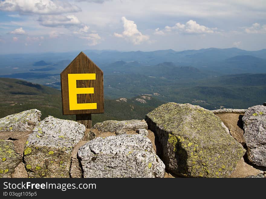 Sign indicating you are facing east found at the top of Whiteface Mountain