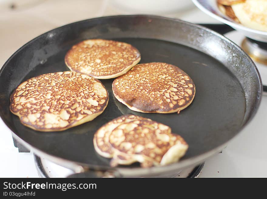 Cooking pancakes in a frying pan