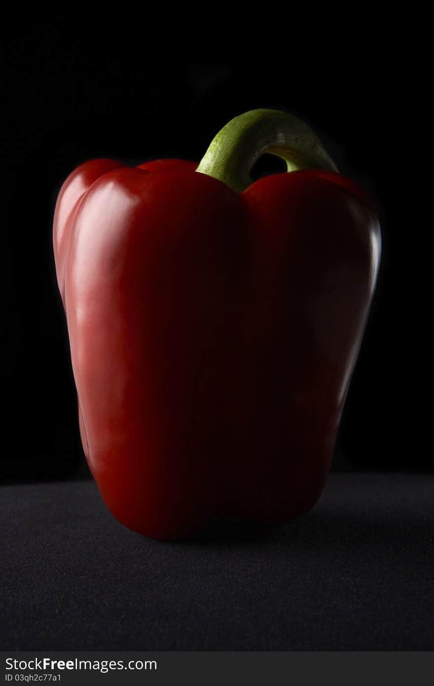 Red Pepper on a black velvet background. Red Pepper on a black velvet background.