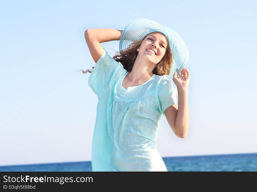 Beautiful woman on sea background