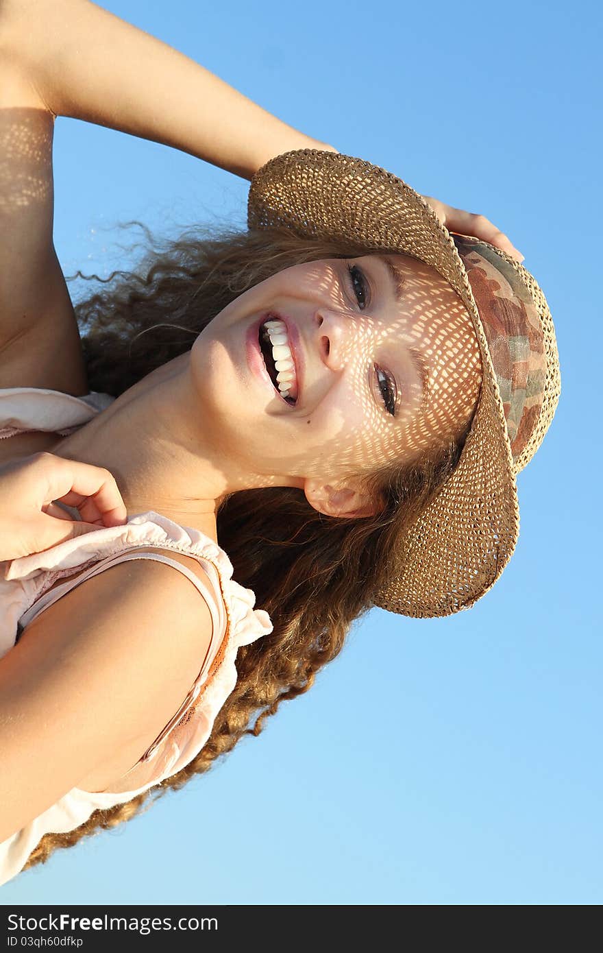 Smiling woman on sky background