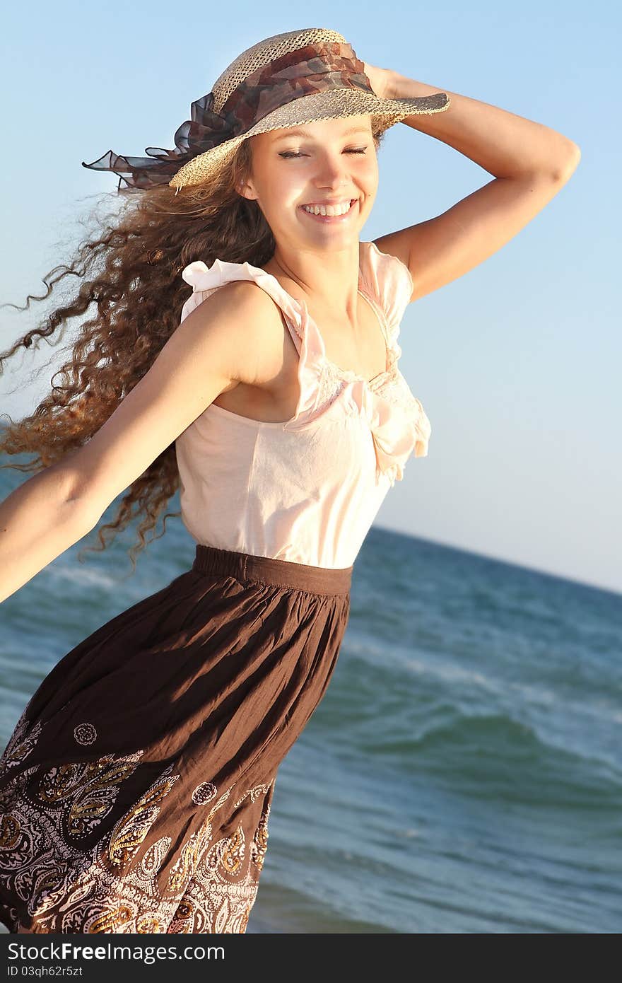 Happy woman on sea background