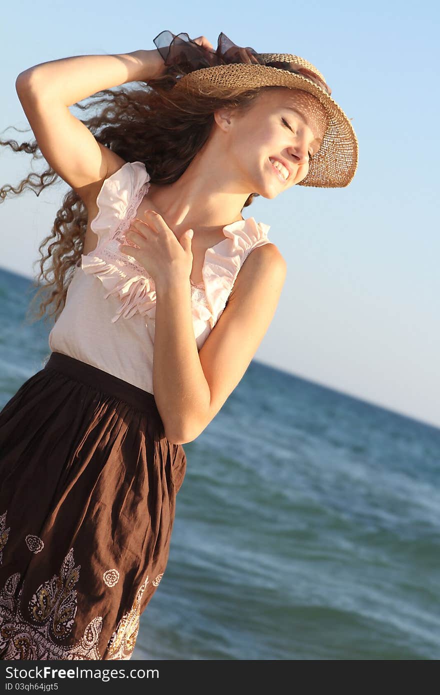 Happy woman on sea background