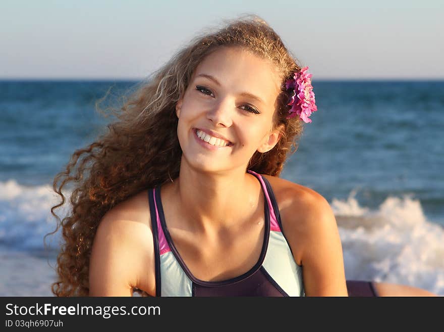 Smiling woman on sea background