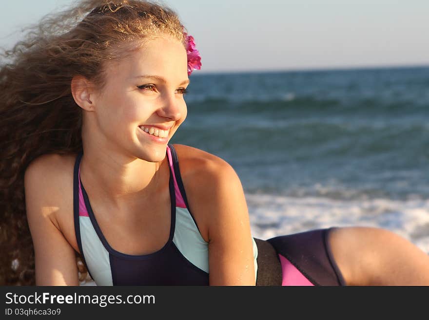 Smiling woman on sea background