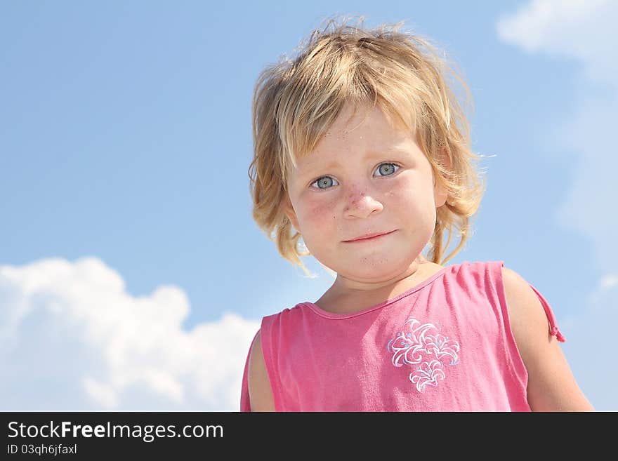 Young girl on sky background