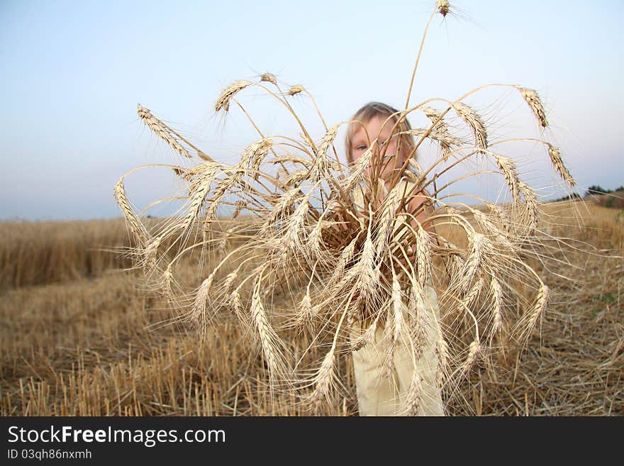 Child with wheat ears