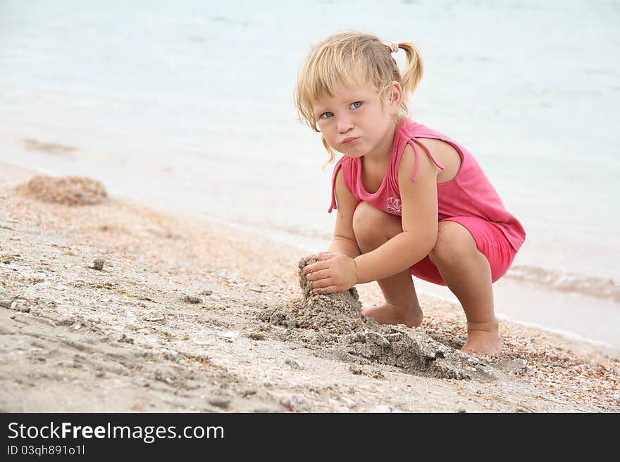 Girl Playing On Beach