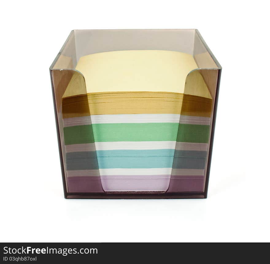 Plastic box with color paper for notes on white background