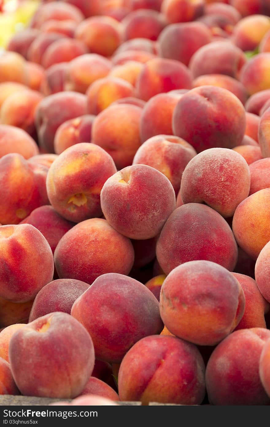 Pile of peaches for sale.