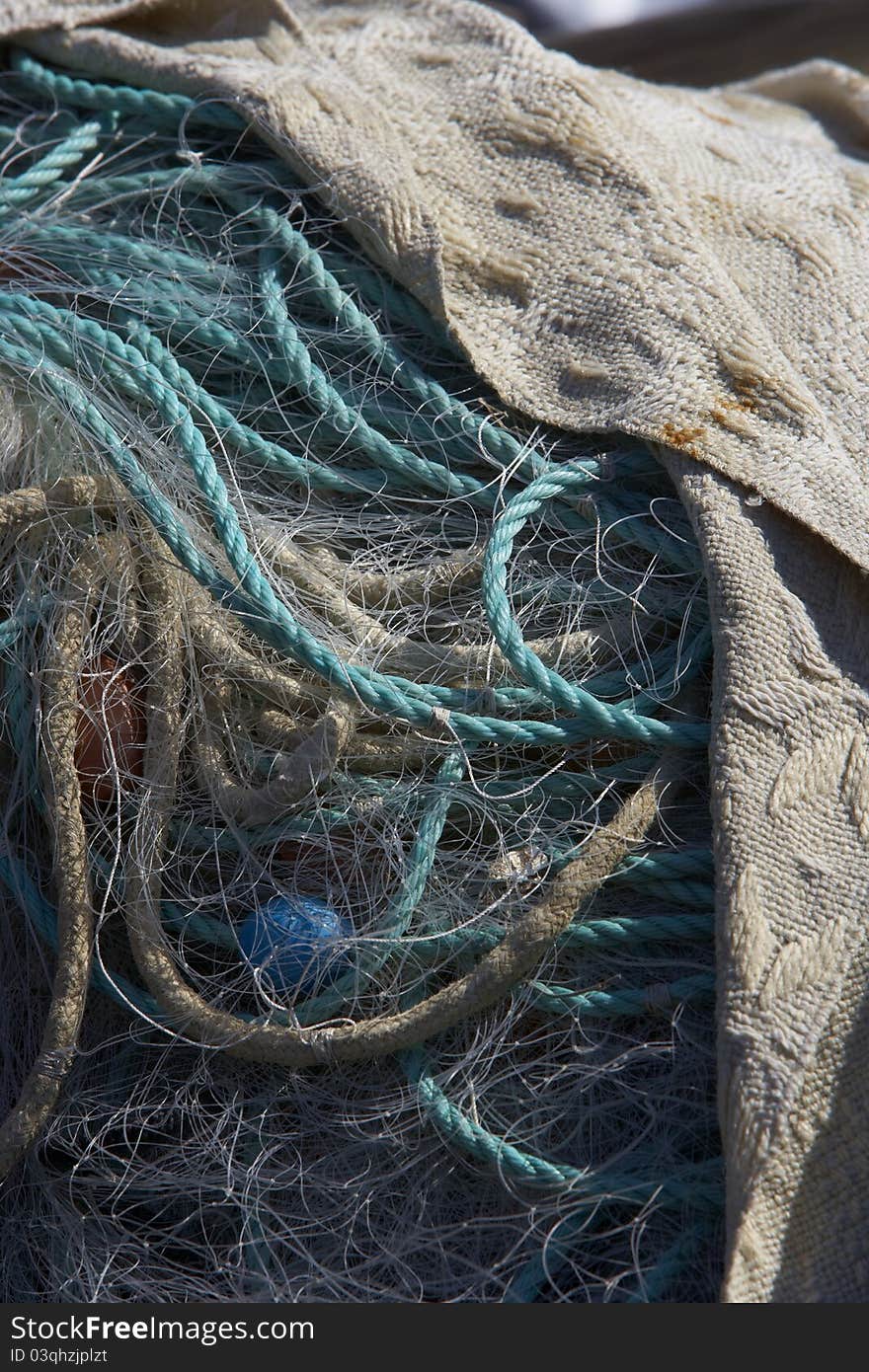 A Pile Of Fishingnets And Ropes Covered