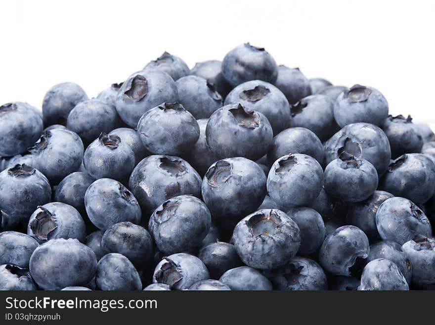 A plate with many blueberries. A plate with many blueberries