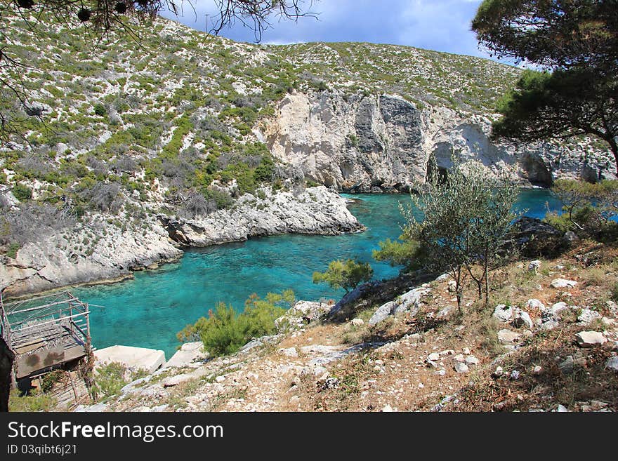 The Blue Lagoon on the Greek island of Zakynthos. The clear water is reflected in various shades of blue in the lagoon. A popular destination among tourists. The Blue Lagoon on the Greek island of Zakynthos. The clear water is reflected in various shades of blue in the lagoon. A popular destination among tourists.