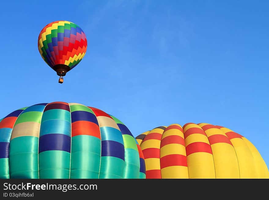 Hot air balloons over blue sky