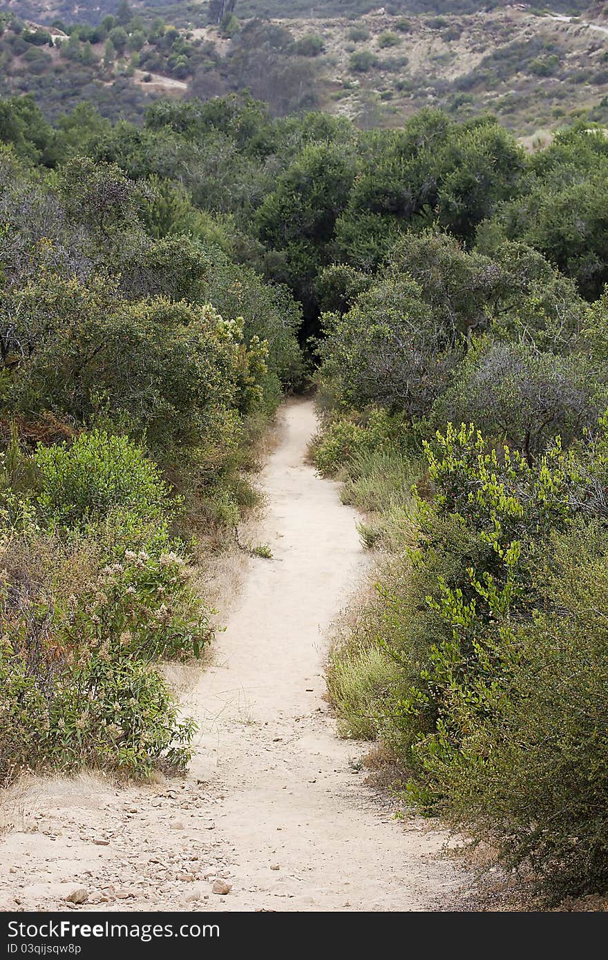 A long hiking path in a mountainous region.