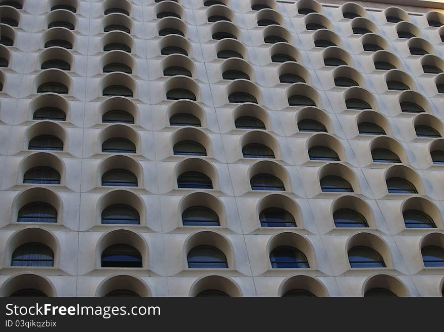 Textured and arched windows of a downtown Phoenix Arizona hotel. Textured and arched windows of a downtown Phoenix Arizona hotel.