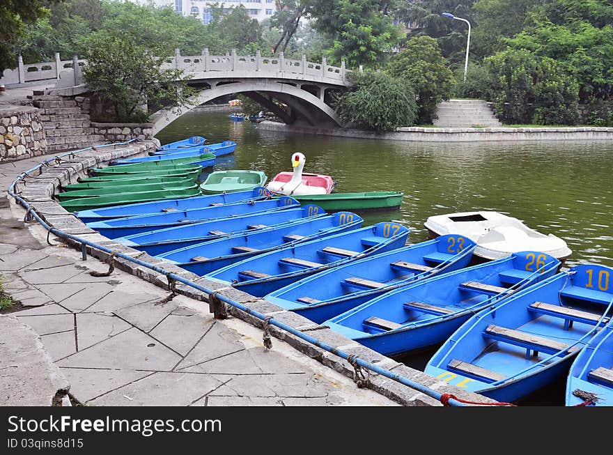 Blue boats on a lake in the park