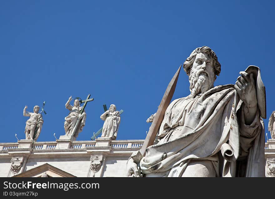 Statues in St. Peter Square (Rome, Italy) with blue sky background. Statues in St. Peter Square (Rome, Italy) with blue sky background