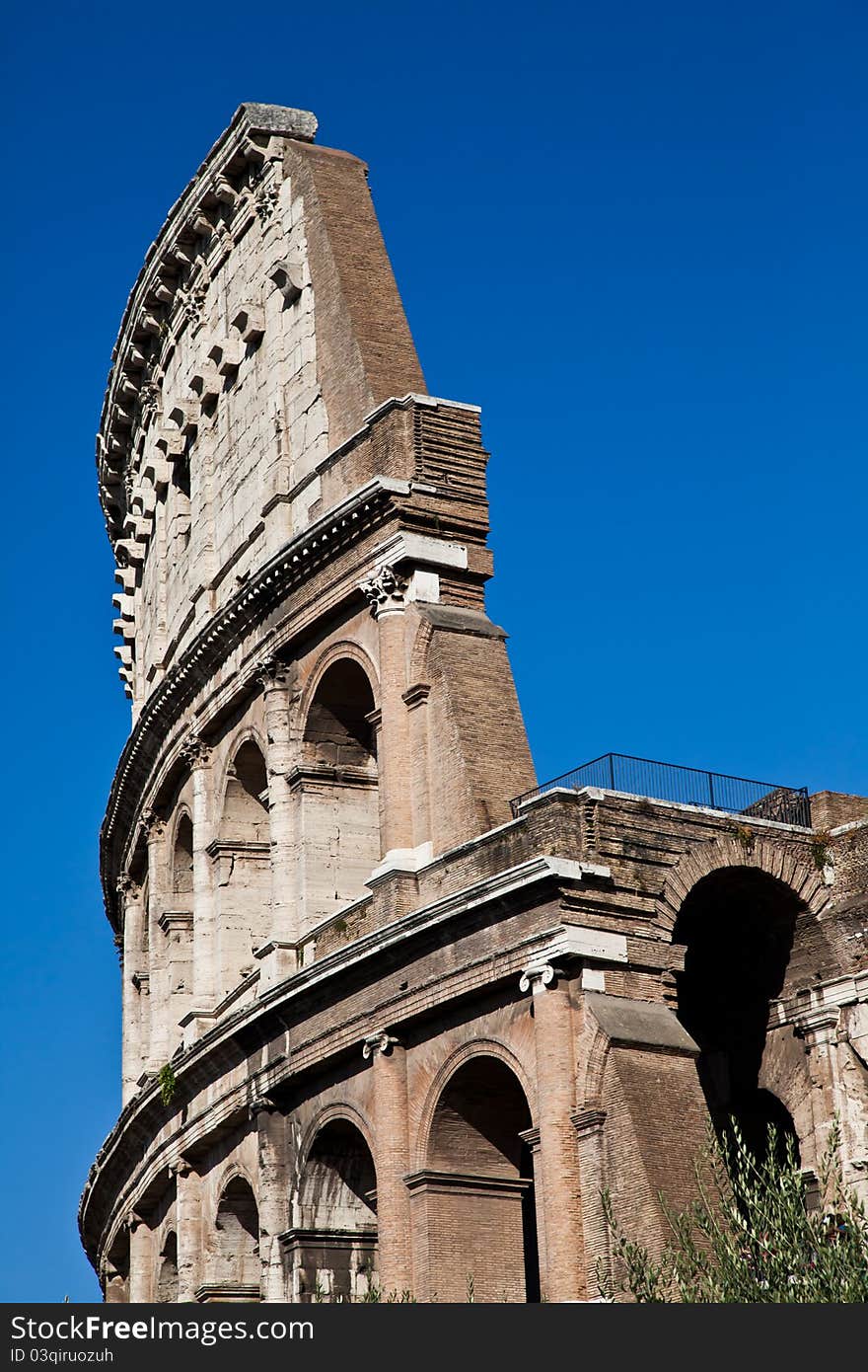 Colosseum in Rome with blue sky, landmark of the city. Colosseum in Rome with blue sky, landmark of the city