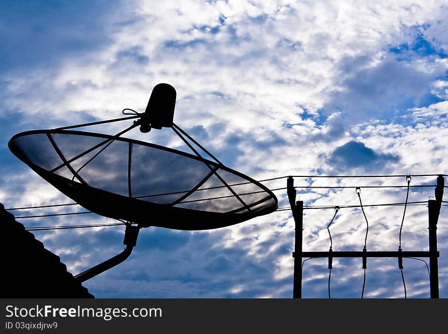 Satellite dish and electricity post