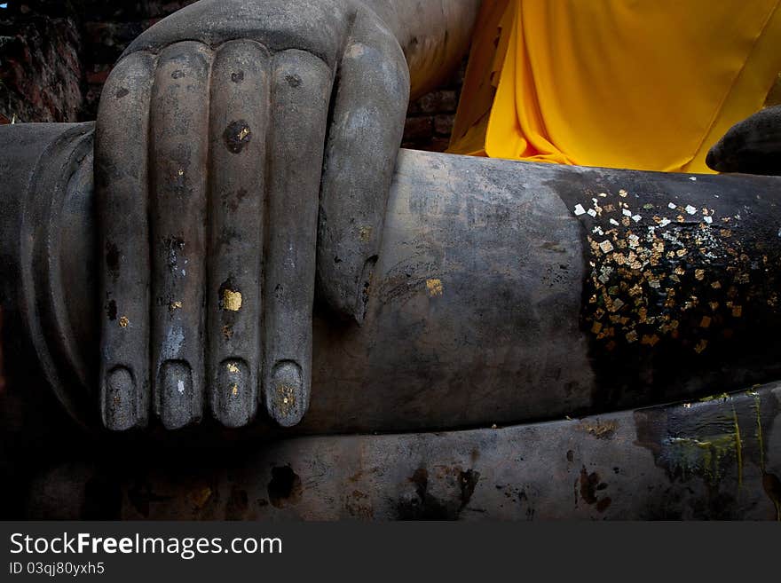 Hand of buddha sculpture with gold