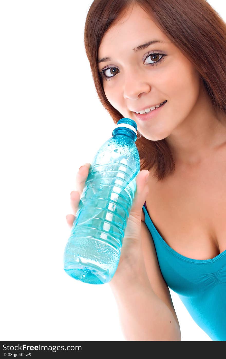 Thirsty young woman drinking water after fitness workout. Isolated on white. Thirsty young woman drinking water after fitness workout. Isolated on white