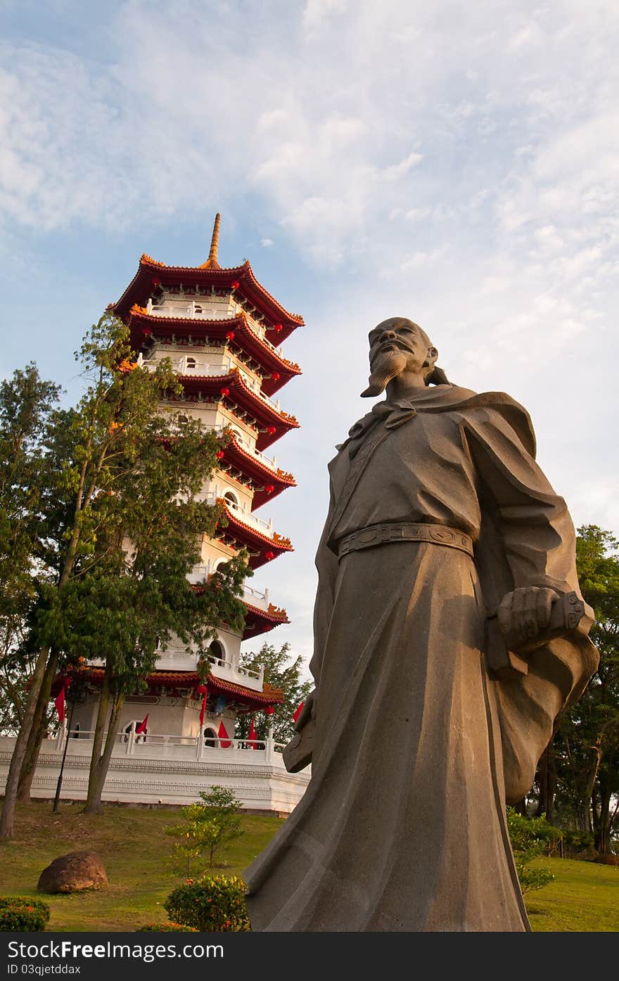 Historical Chinese statue and Oriental pagoda in Chinese Garden at sunrise. Historical Chinese statue and Oriental pagoda in Chinese Garden at sunrise.