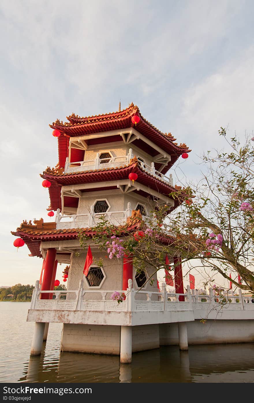 Single traditional Chinese pagoda built on water for good luck. Single traditional Chinese pagoda built on water for good luck.