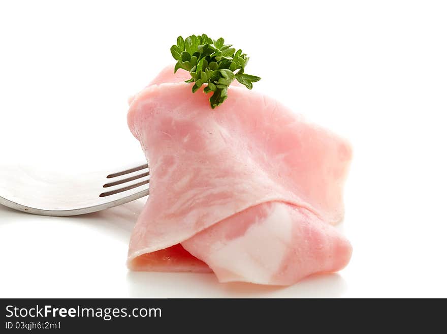 Soft ham slice wrapped on fork