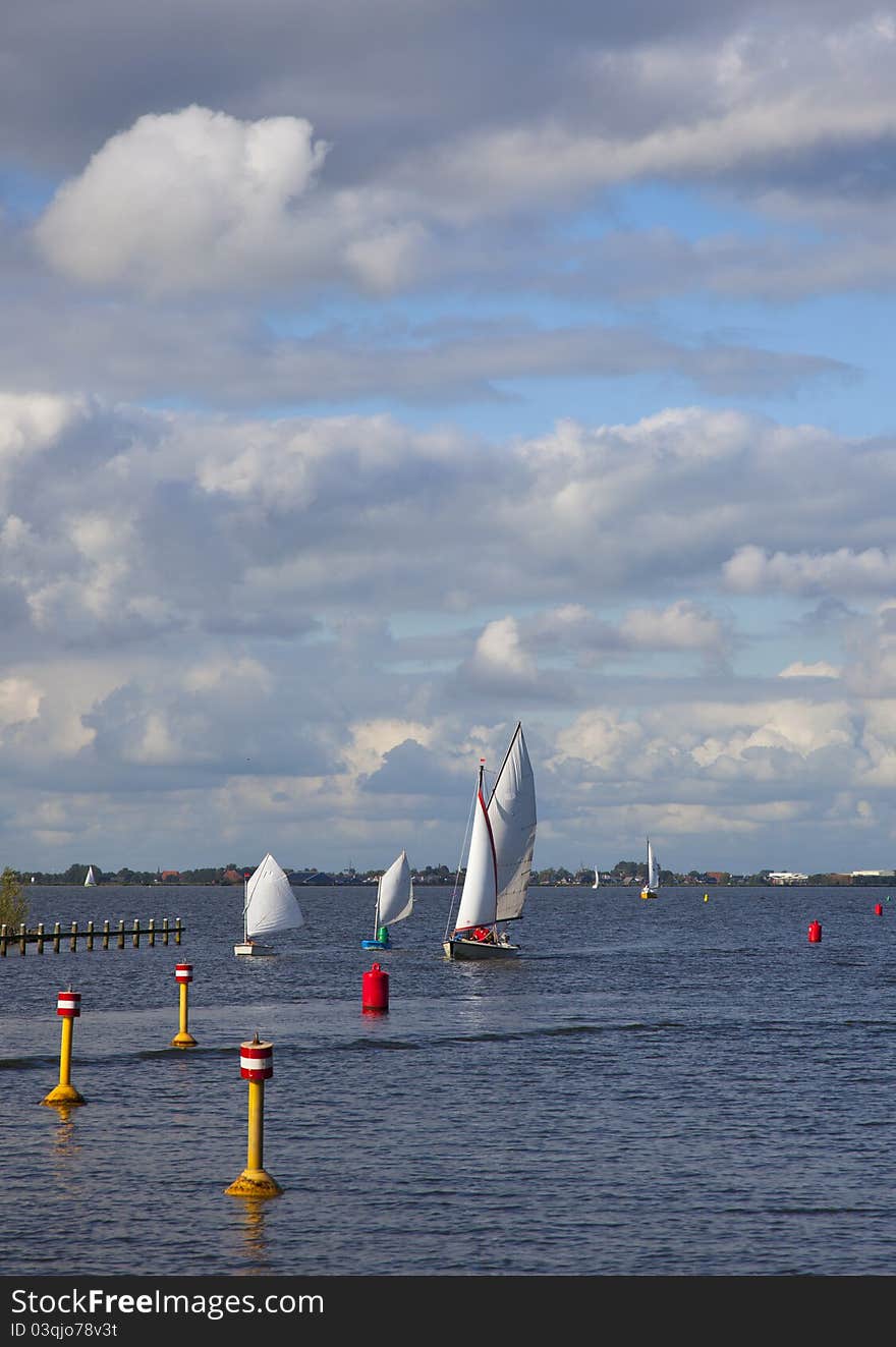 A small sailboat on dutch water. A small sailboat on dutch water