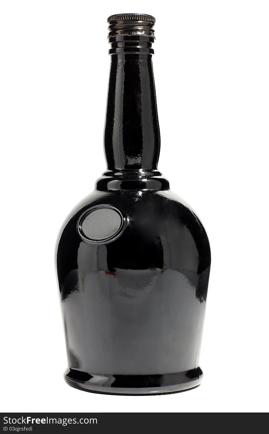 Color photo of a black glass bottle with a white background. Color photo of a black glass bottle with a white background