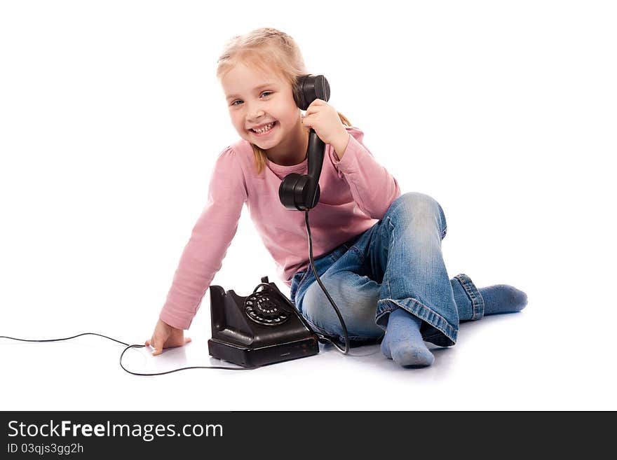 Beautiful girl talking on the phone on white