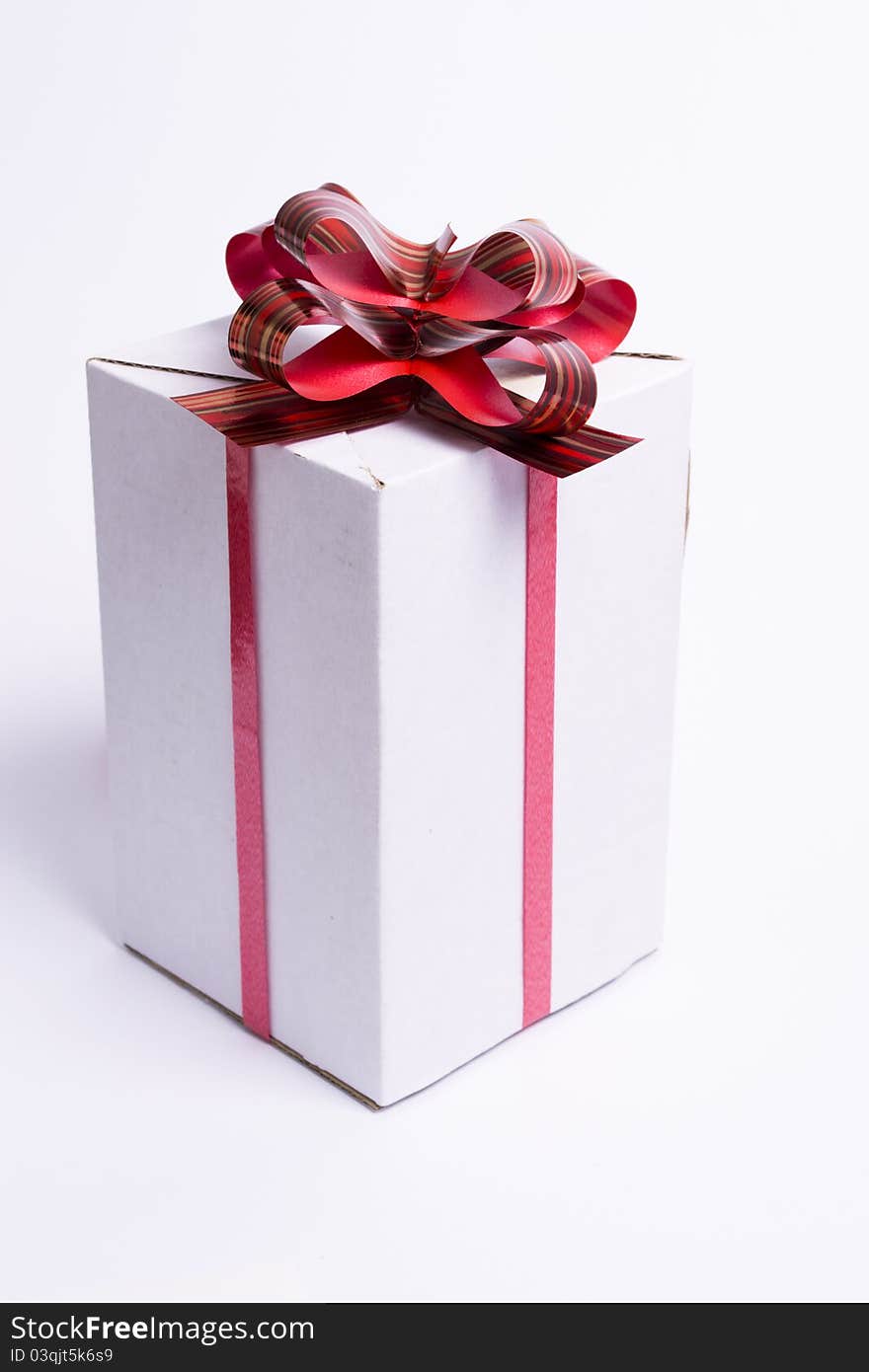 White box with red ribbon and bow