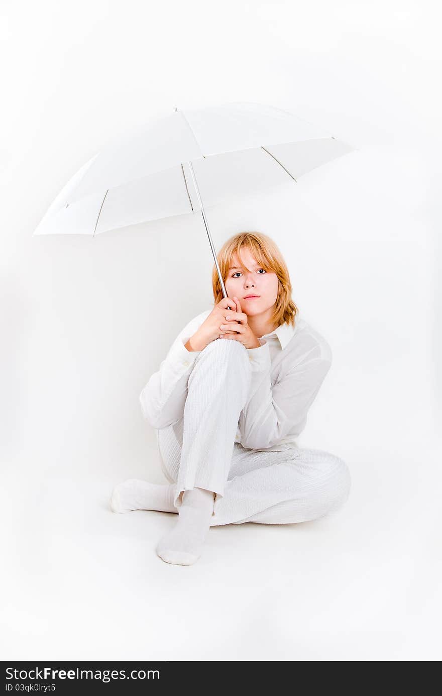 Girl sitting with white umbrella overwhite