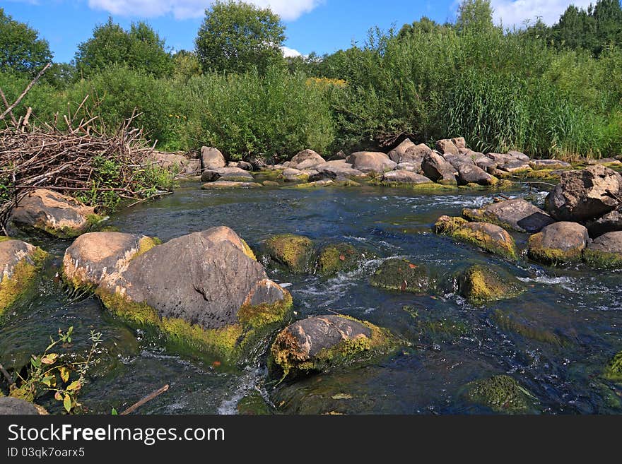 Mountain river flow between stone