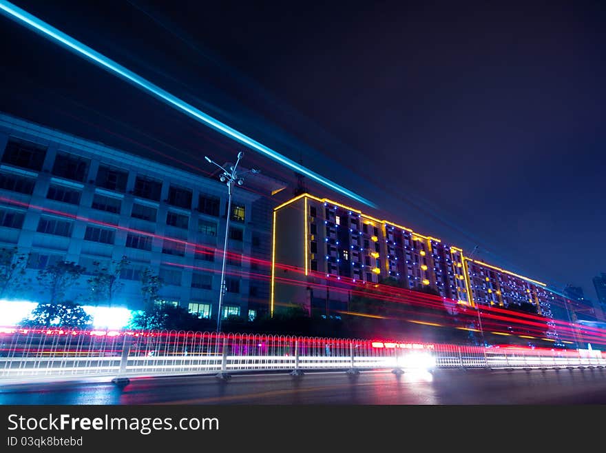 The light trails on the modern building background in shanghai china.