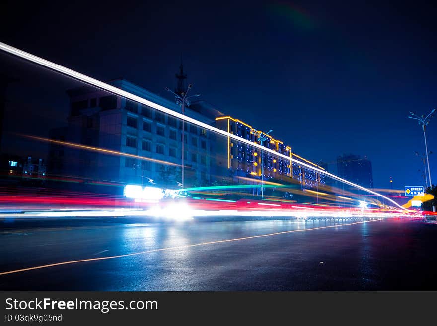 The light trails on the modern building background in shanghai china.