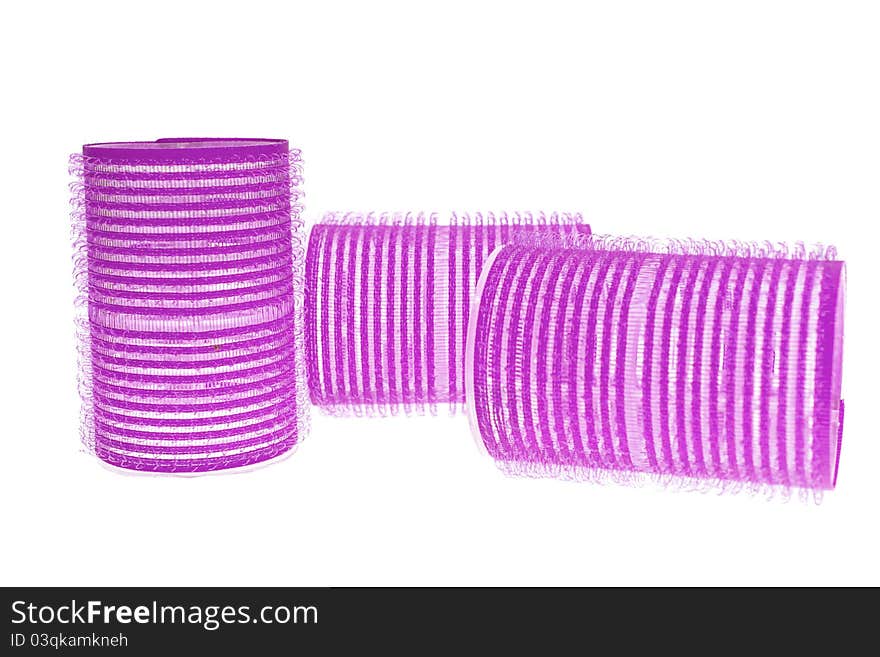 Pink curlers isolated on a white